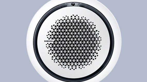 Ein runder Lautsprecher mit einem modernen, geometrischen Gitterdesign in Schwarz und Weiß, ideal für stilvolle Räume.